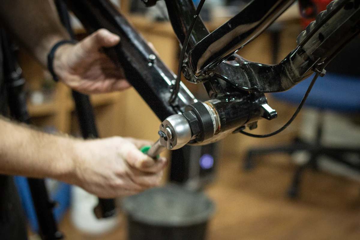 Hands fitting a new bottom bracket