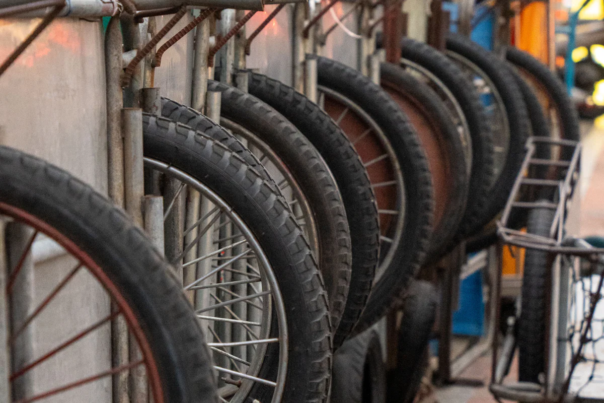 Donated bikes lined up in a rack waiting to be fixed